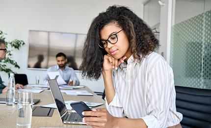 An employee working on a smartphone